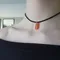 Carnelian crystal on black suede choker