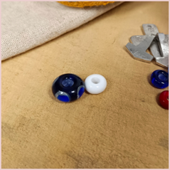 the repton bead and a small white bead