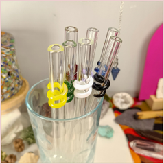 Multiple colours of straws inside a glass