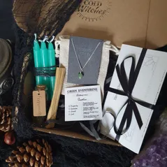 Peace spell box containing green candles, palo santo stick, jar of dried peppermint, a handmade green aventurine sphere crystal necklace on dainty silver chain and an original ritual wrote by a  witch