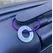 1 inch aluminium washer stamped with the words living my best life.  the washer hangs on a purple wire loop to make a luggage tag.  the item is shown attached to the handle of a suitcase