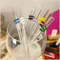 Multiple colours of straws inside a glass