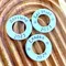image shows 3 additional 1 inch aluminium washers which can be added to any wire luggage tag.  the washers shown are stamped with the words scotland 2023, las vegas 2023 and london 2024.  the listing is for one personalised additional washer which can be added to any wire luggage tag.