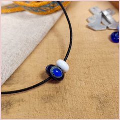the repton bead and a small white bead on a cord