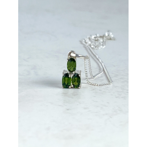 Front view of triple stone green chrome diopside pendant