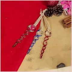 Flatlay of three glass icicle decorations