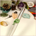 Close up of a handmade glass straw with a leaf design
