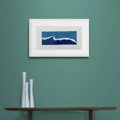Blue White and Teal Waves Print in Framed in White on a Blue Wall Above Dark Shelf and Vase Set