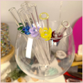 Multiple colours of straws inside a glass