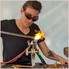 Photo of Scarlet at the flame melting glass