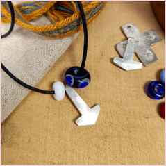 the repton bead and small white bead with a pewter mjolnir on a cord