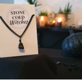 Black Obsidian crystal bound simply with a black wire onto a chunky black chain
