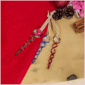 Flatlay of three glass icicle decorations