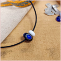 the repton bead and a small white bead on a cord