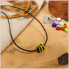 Subbersund Wasp Bead. A black bead with three raised lines of yellow shown on a cord