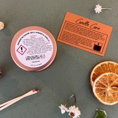 orange blossom wild juniper and vanilla candle clp label and candle care card