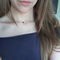 small shiny crescent moon on a dainty short choker style chain